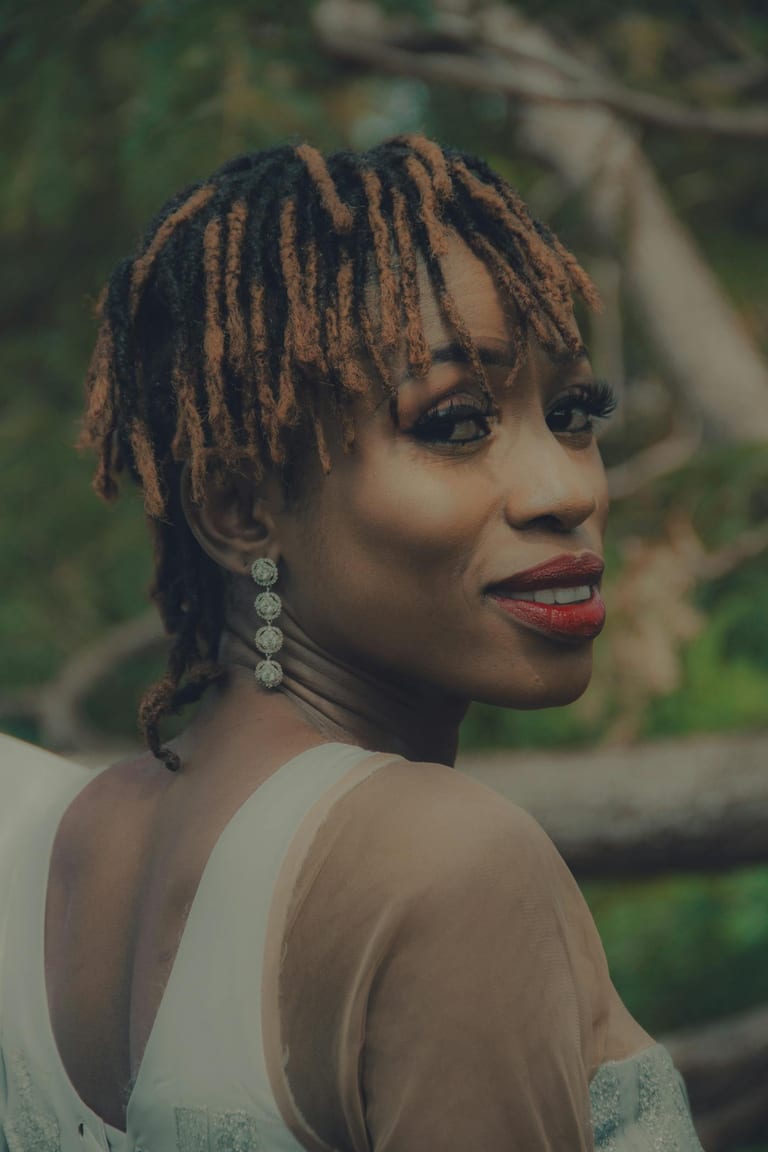 Outdoor portrait — long, brand new locs