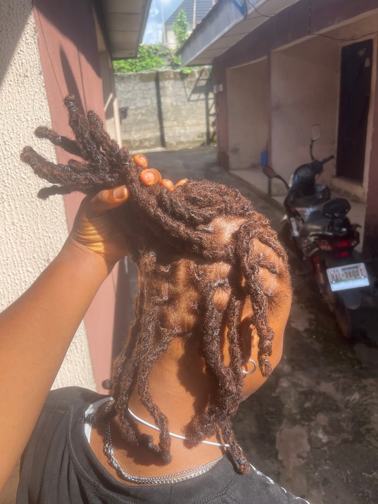 Portrait of a client with matured locs